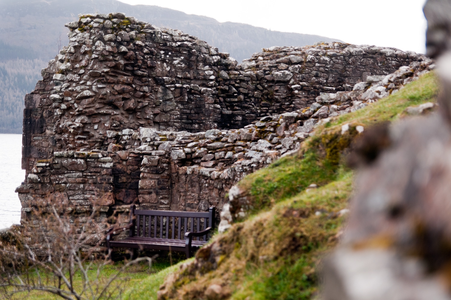 A Bench By A Wall In A Castle On The Loch